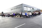 Shoppers Queue on opening day at the John Lewis at home store in Poole