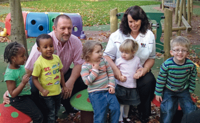 Gary and Claire Holmes with children at Stepping Stones
