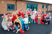 Furness College nursery staff and children