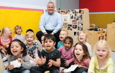 Chief executive Andy Morris with Asquith nursery children