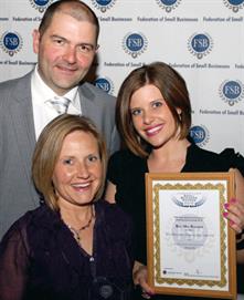 Tim Landreth and Katie Landreth with the award (right) and nursery manager Debbie Leslie