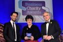 Business Charity Award winner Kate Neville with Third Sector's Alex Hay [left] and BBC News presenter Huw Edwards