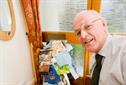 David Hasted with charity mailshots and gifts