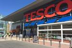 Tesco sees hope after halving sales decline