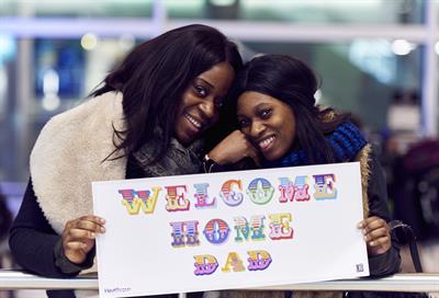 Watch: Heathrow and street artist create customised 'Welcome home' banners