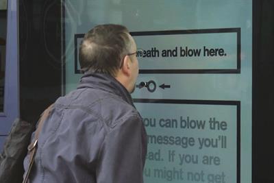 Cancer Research UK invites smokers to puff into bus shelter