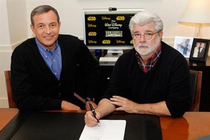 Disney chairman and CEO Bob Iger (l) and George Lucas
