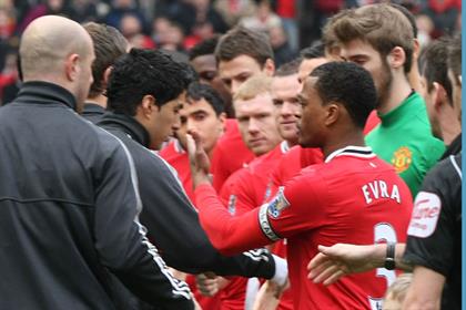 Race row: Luis Suarez refused to shake Patrice Evra's hand (Getty Images)