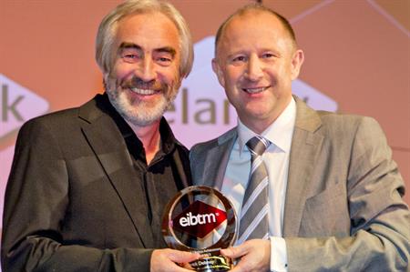 Patrick Delaney (left) picks up lifetime achievement award at EIBTM