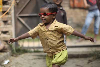 Erina celebrating after having her sight restored [Charlie Bibby/Financial Times]