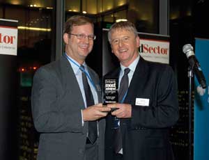 Children's Society chief executive Bob Reitemeier (left) receives the award from Stephen Pittam, chief executive of last year's winner, the Joseph Rowntree Charitable Trust