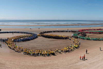 On Merseyside, 6,000 children broke the world record to create the largest human Olympic rings