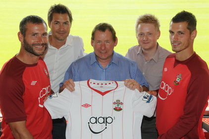 Aap³ CEO Rod Jackson, centre, with Southampton FC players and some of the Remarkable Group team