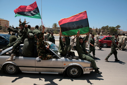 Libyan rebels: protesting Gaddafi rule [pic Rex Features]