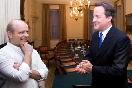 Victorious: Hilton with Cameron on the night he became PM (Rex Features)