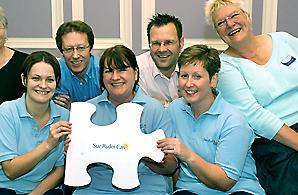 Sue Ryder Care volunteers with one of the jigsaw pieces used to promote the 'Perfect Fit' campaign. Photograph: Roger Pattison, Pocklington Post.
