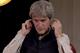 Sir John Hegarty on headphones