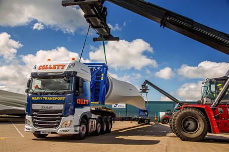 Two reach stackers load the 50-metre blades onto the trailer for deliver to Crook Hill project