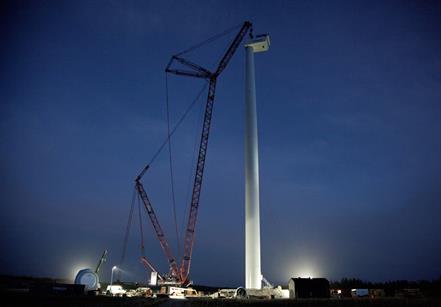 The nacelle being installed on top of the 140-metre tower