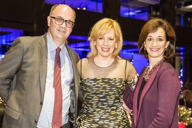 Editorial director of PRWeek global Steve Barrett (left) congratulates Southwest Airlines' Ginger Hardage (center) on her induction to the PRWeek Hall of Fame