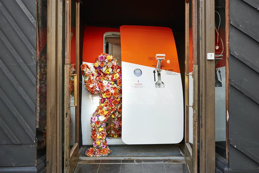 The flowery star of EasyJet's 'Why not?' campaign peeps out of a hidden plane door in Shoreditch (All photos: Nathan Pask at Kayte Ellis Agency)