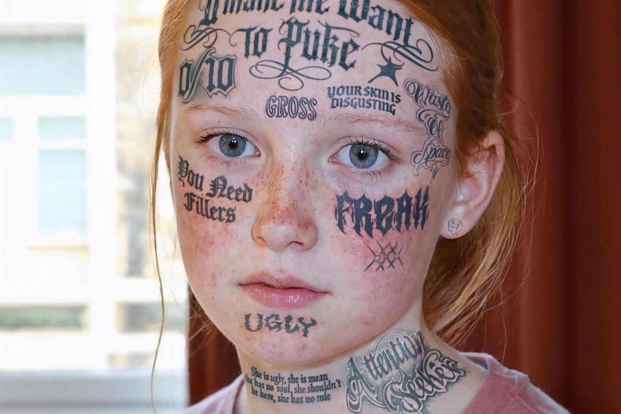 Cybersmile highlights permanence of online abuse with tattooed faces of children
