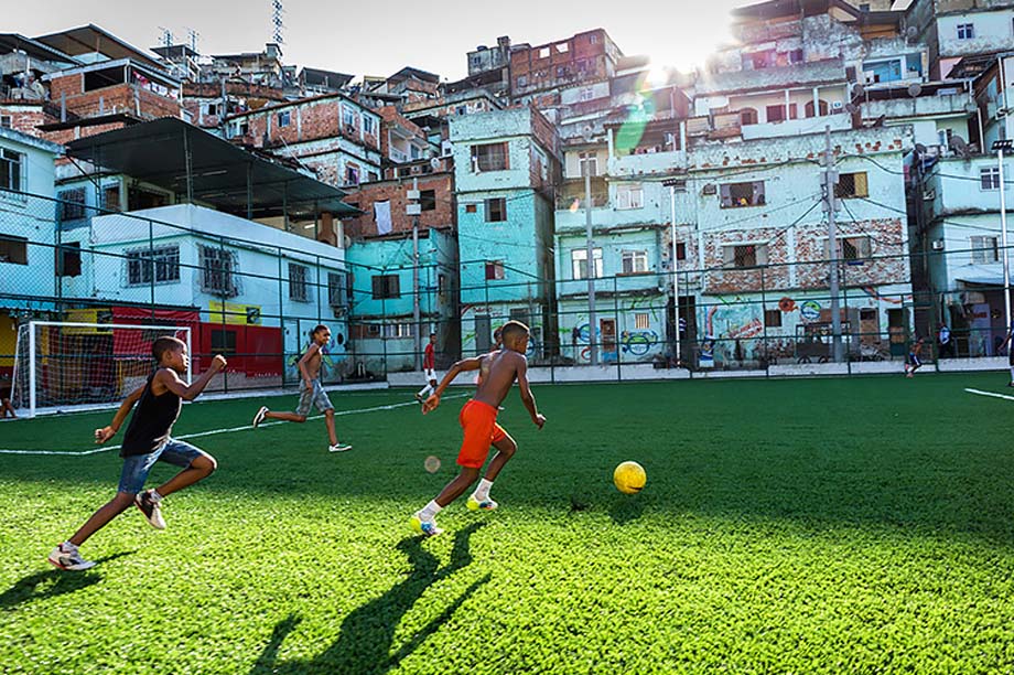 Kids playing soccer in the streets