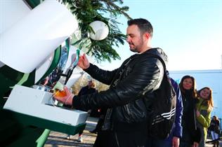 The Christmas tree serves complimentary beer to passers-by 