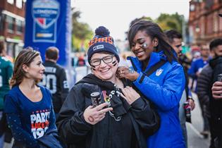 People attend events at NFL South Bank, in London, Saturday, Oct