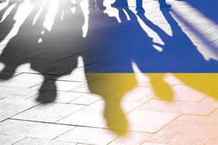 Shadow of people with Ukraine flag colours 