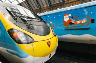 Two of Virgin's trains have been transformed to showcase childrens' Christmas designs