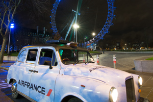 Air France's London taxi projecting laser images onto skyline