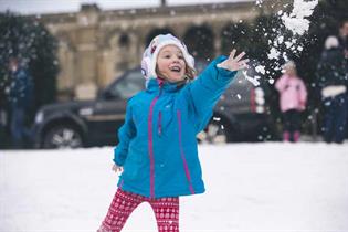 Kids and families enjoy the snow, created by Land Rover at Alexandra Palace