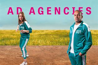 Natalie Graeme and Julian Douglas dressed in Squid Game-style green and white tracksuits against background of field and horizon