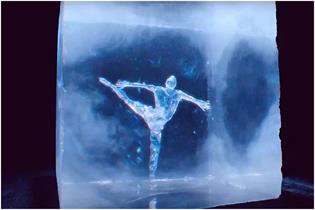 Figure skater made out of ice performing inside an ice cube