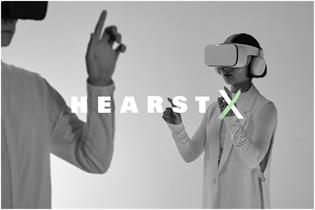 HearstX logo and two people wearing VR headsets 