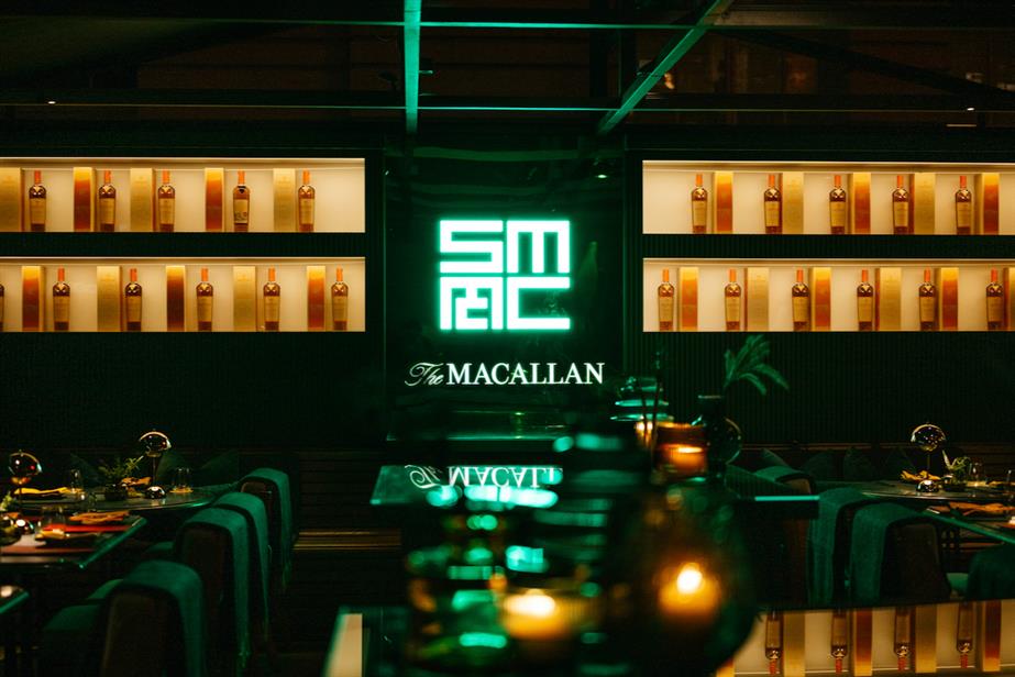 The Macallan branding in green neon light at The Rosewood Hotel in London