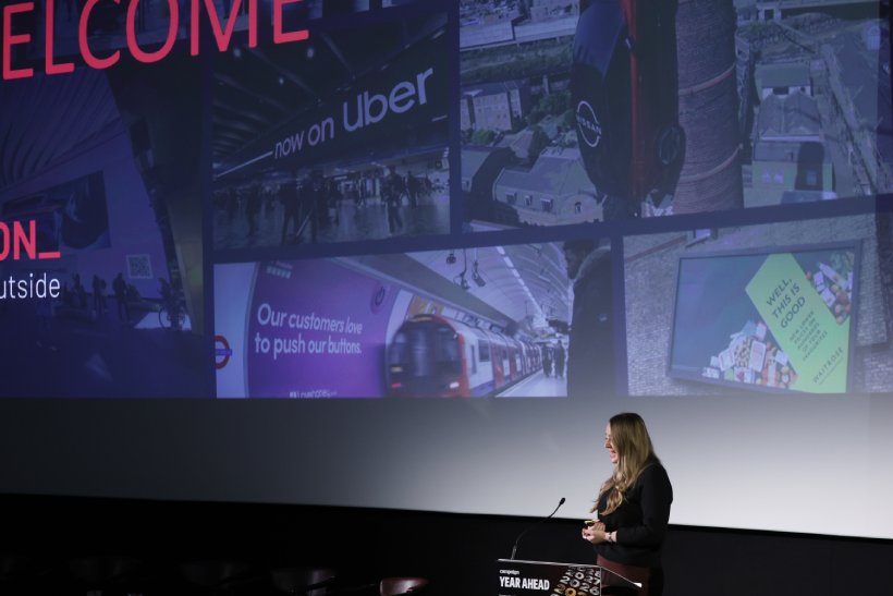 Woman on stage presenting