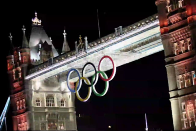 Olympic rings:hoisted into place on Tower Bridge
