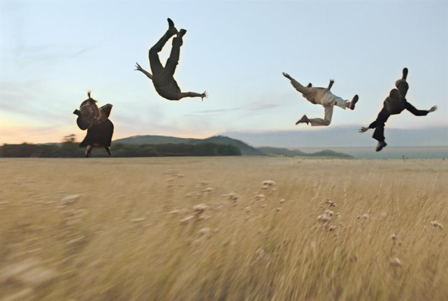 Am image from Burberry's 'Open Spaces' ad featuring four people floating above a wheat field