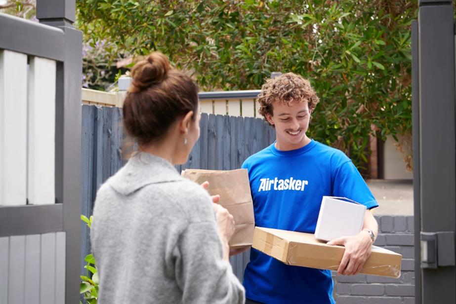 Airtasker worker holding boxes