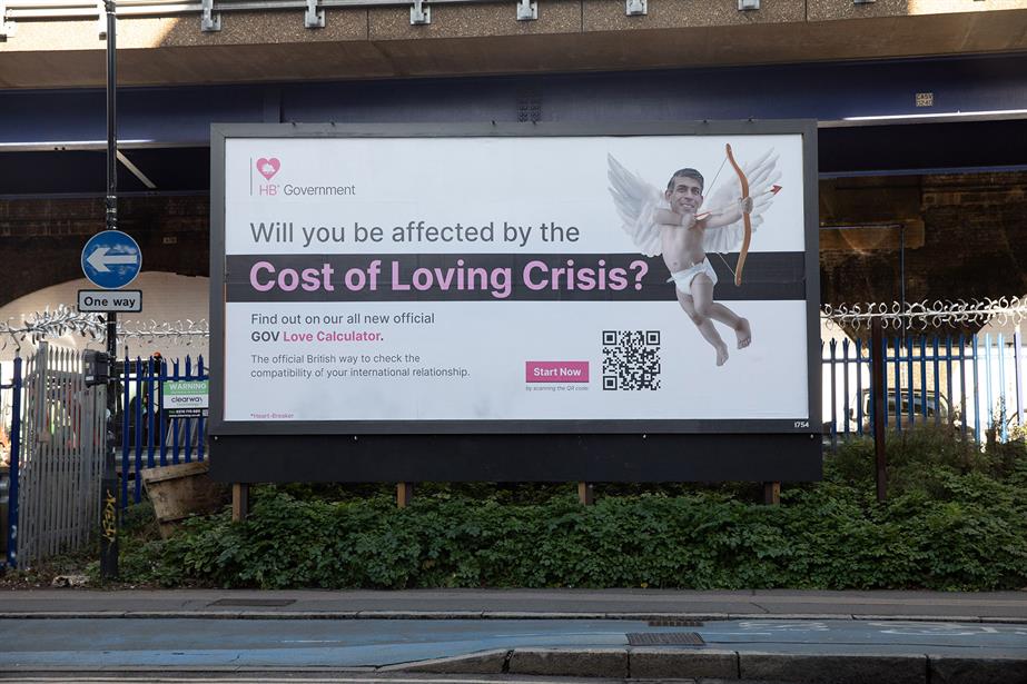 A billboard carrying an image of Rishi Sunak and the words 'Will you be affected by the cost of loving crisis?'