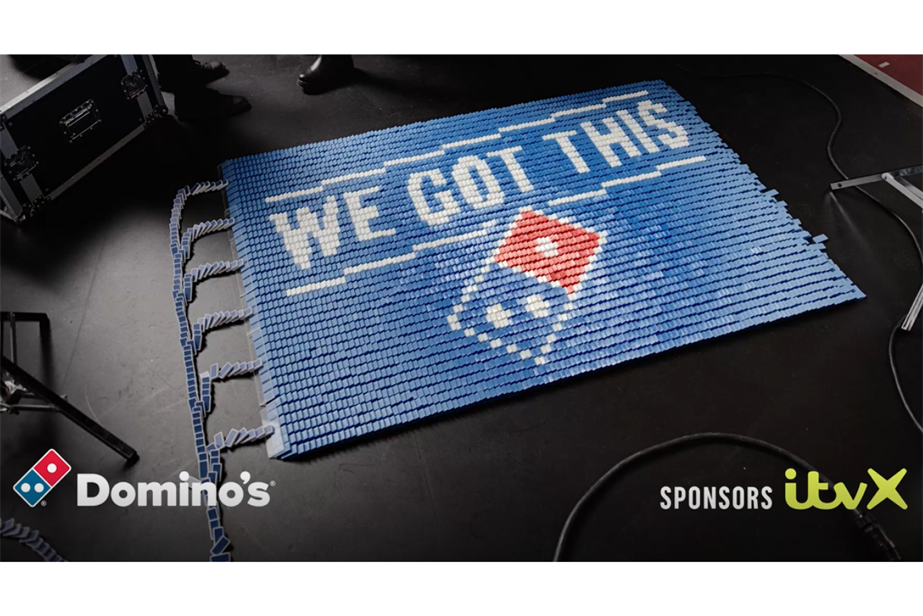 A Domino's logo, which reads "We got this", and is made up of smaller dominoes