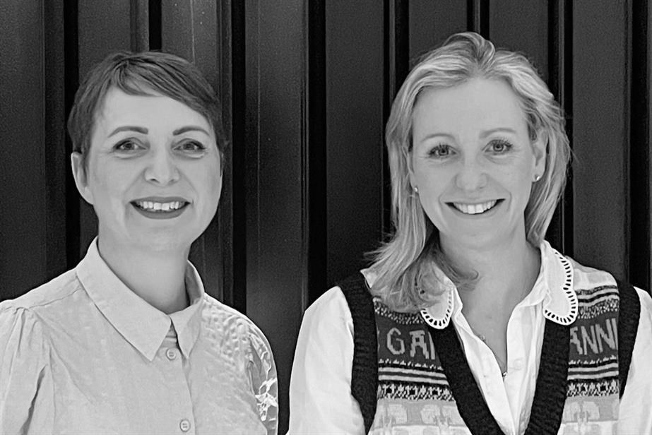 A black and white photo of Maxene Edghill and Claire Hollands