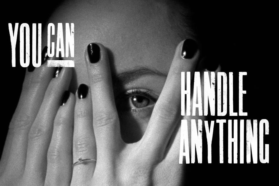 A still from the Ineos TV ad showing a woman covering her face with her hands
