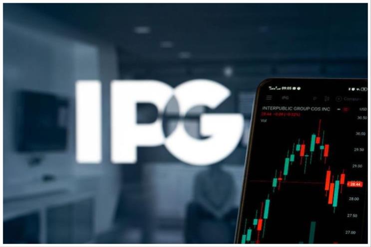 IPG's logo in white against a blue-grey background, to the right a screen displaying a green and red chart denoting financials performance