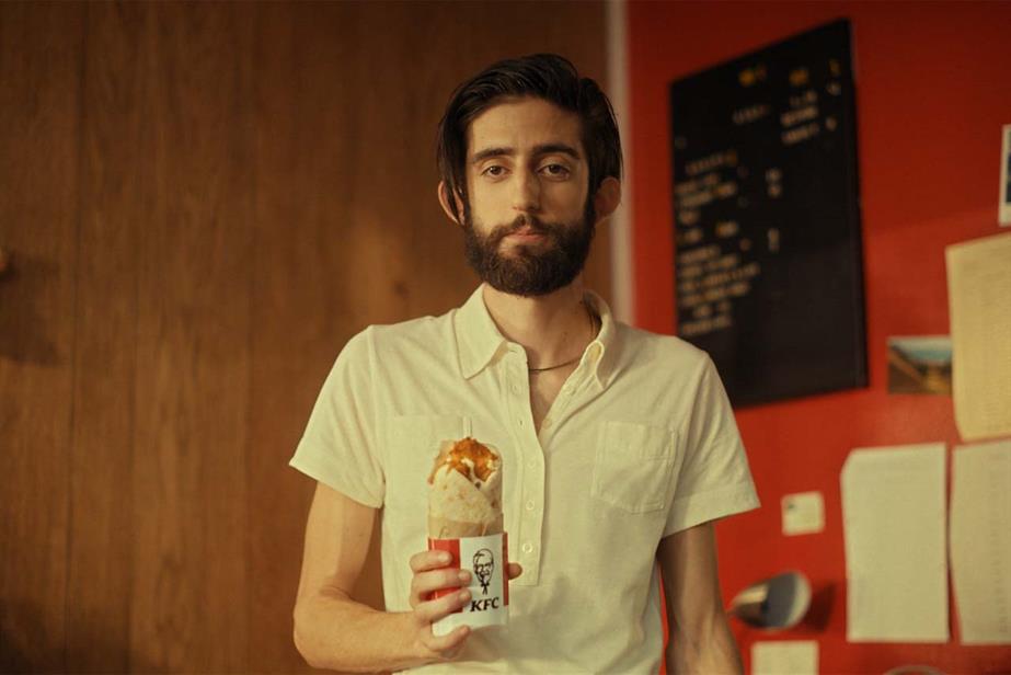 KFC ad with man holding KFC wrap