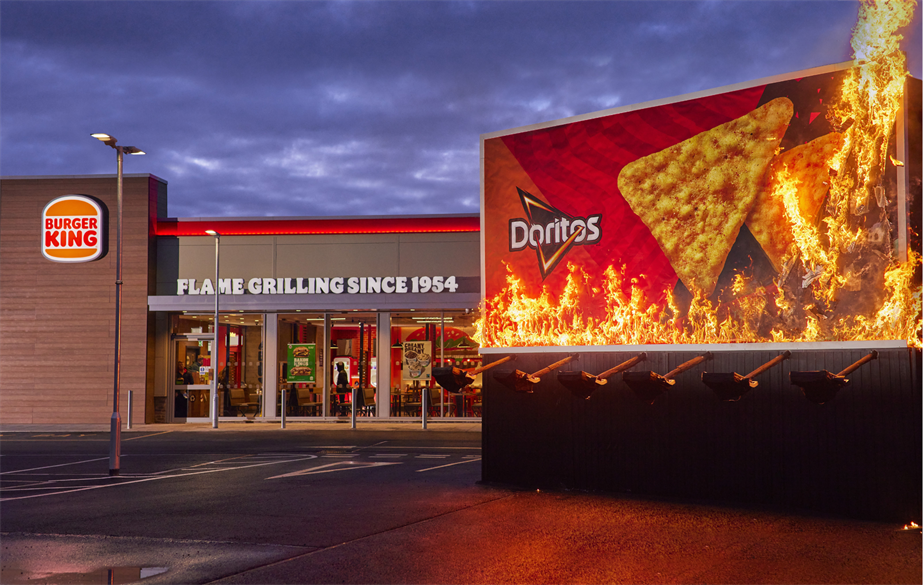 A burning Doritos billboard appeared next to a Burger King restaurant 