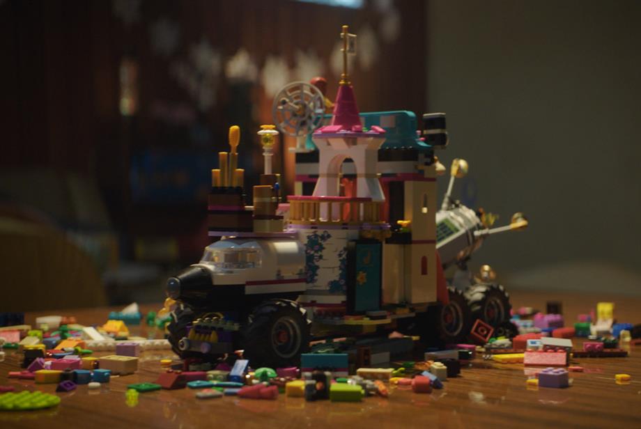 Children built a Lego car in the toy company's Christmas spot