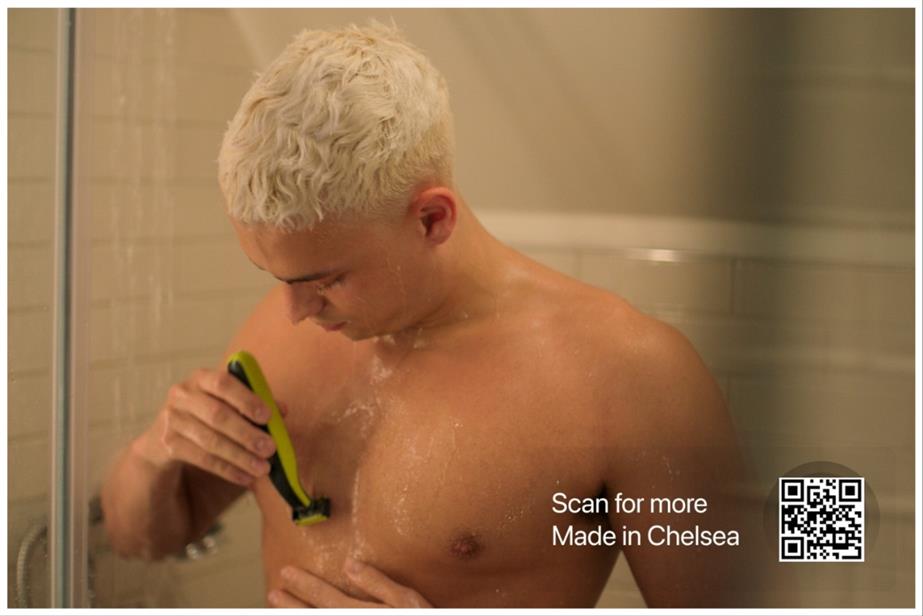 Made in Chelsea star Joel Mignott shaves his chest with a Philips razor. A QR code in the bottom right corner gives audiences access to buy the razor online.